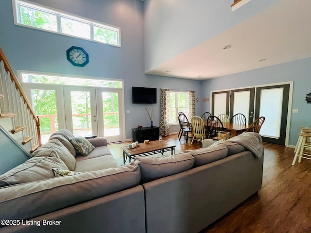 216 Peter Cave Heights Rd, Leitchfield, KY 42754 - living room with stairs, wood finished floors, a towering ceiling, french doors, and baseboards