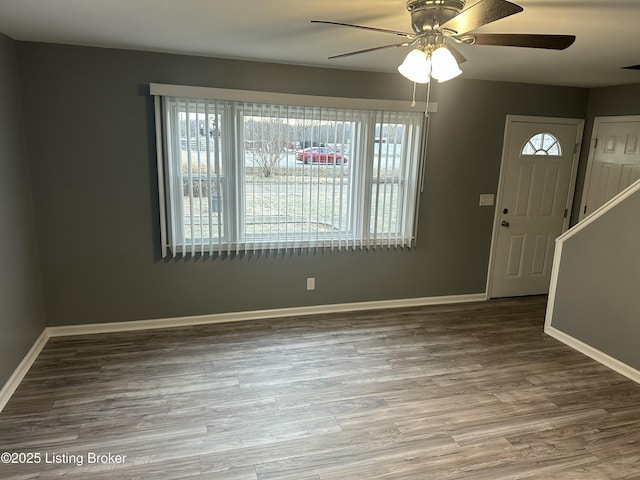 foyer entrance with hardwood / wood-style flooring and ceiling fan