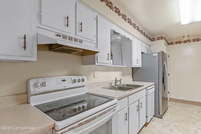 kitchen with white appliances, sink, and white cabinets