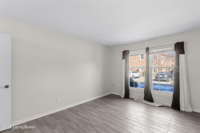 spare room with light wood-type flooring