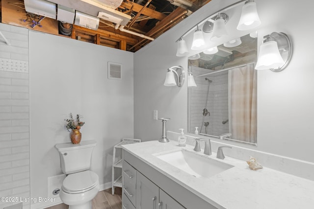 bathroom with vanity, toilet, curtained shower, and wood-type flooring