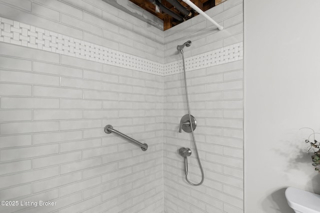 bathroom with tiled shower