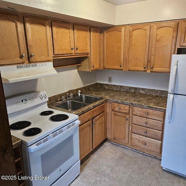 kitchen with sink and white appliances