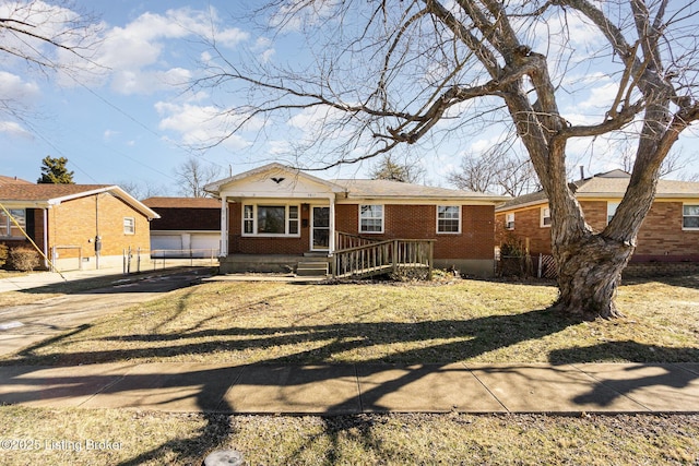 single story home featuring a front yard