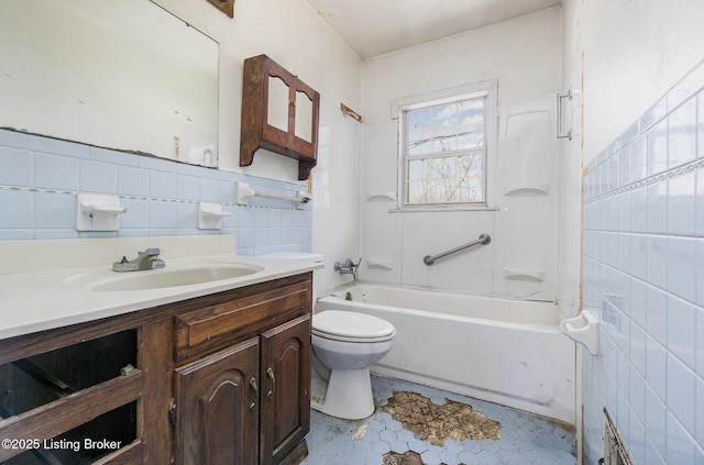 full bathroom featuring tile walls, vanity, shower / tub combination, and toilet