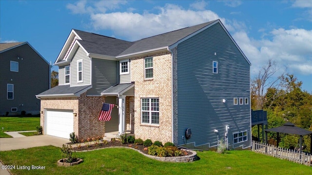 view of front of house with a garage and a front yard