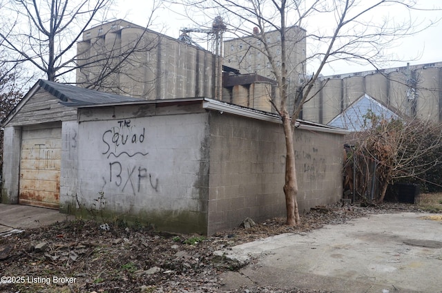 view of home's exterior featuring a garage and an outdoor structure