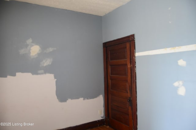 empty room with a textured ceiling