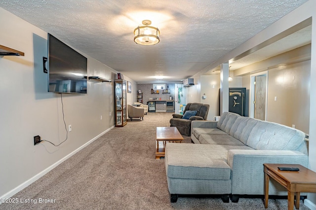 carpeted living room with baseboards, a textured ceiling, and a wall mounted AC