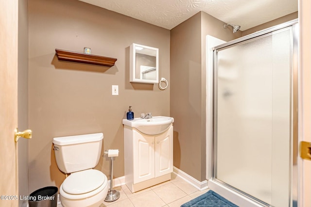 full bathroom featuring toilet, vanity, a textured ceiling, a shower stall, and tile patterned floors