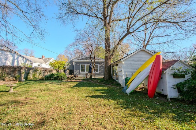 back of house with a yard