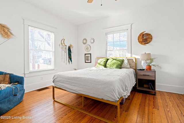 bedroom featuring hardwood / wood-style flooring and ceiling fan