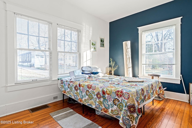 bedroom with hardwood / wood-style floors