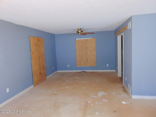 unfurnished room with ceiling fan