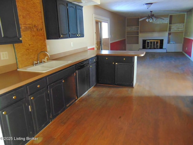 kitchen with sink, dishwasher, ceiling fan, hardwood / wood-style floors, and kitchen peninsula