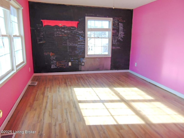 spare room featuring hardwood / wood-style flooring