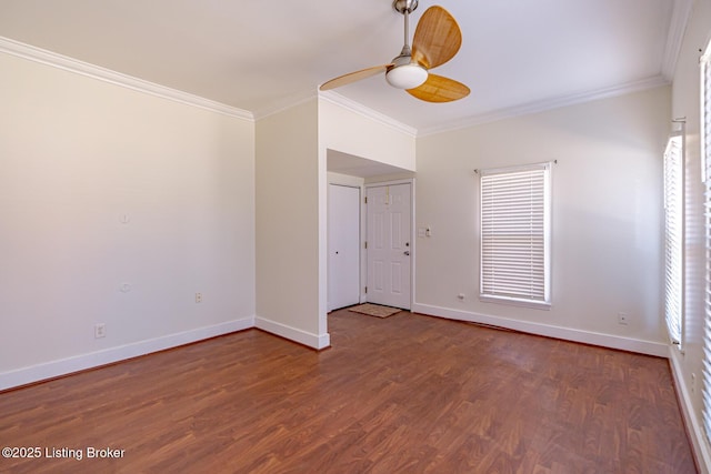 unfurnished room with baseboards, wood finished floors, a ceiling fan, and crown molding