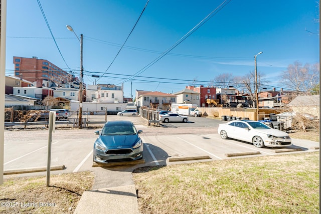 view of street featuring a residential view and street lights