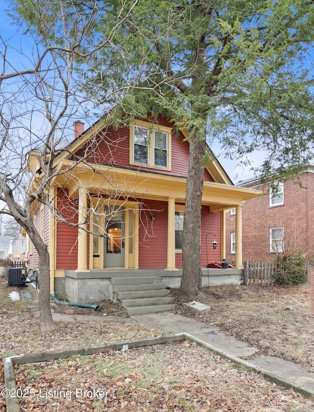 view of front facade with covered porch and central air condition unit