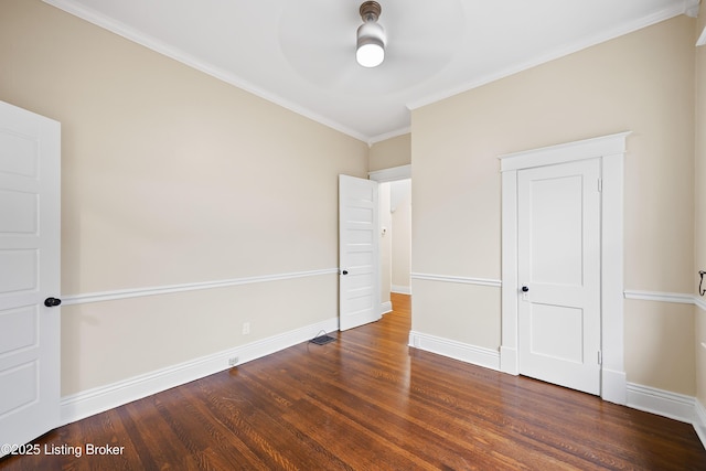 unfurnished bedroom featuring crown molding, ceiling fan, and dark hardwood / wood-style flooring