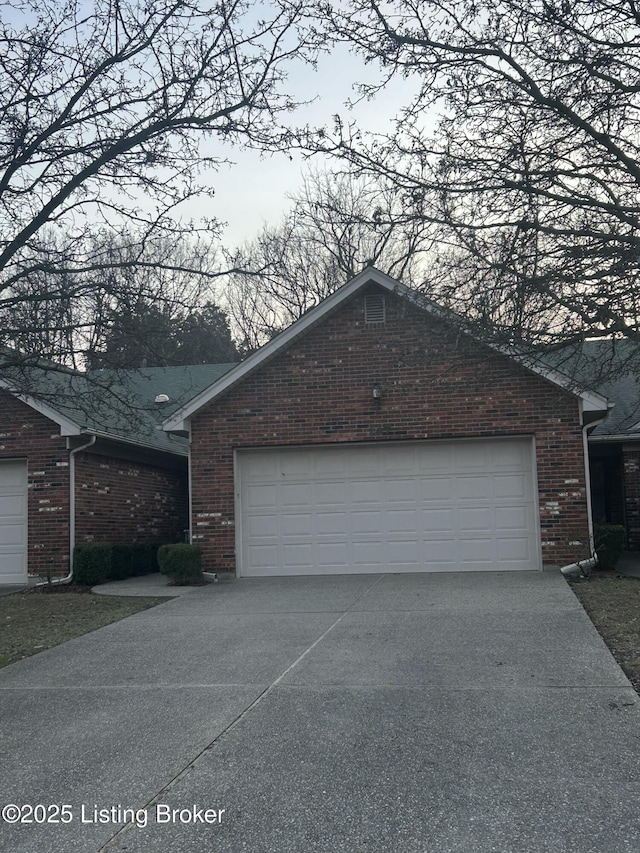 view of side of property featuring a garage