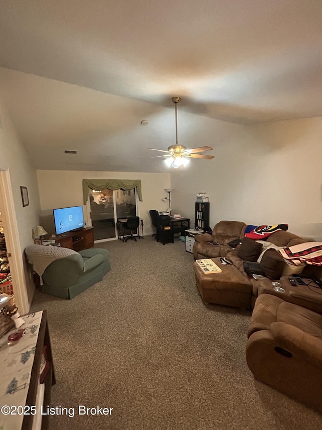 living room with vaulted ceiling, carpet, and ceiling fan