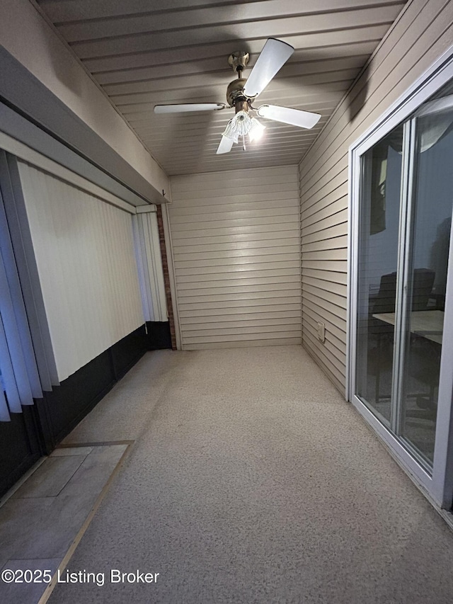 interior space featuring ceiling fan