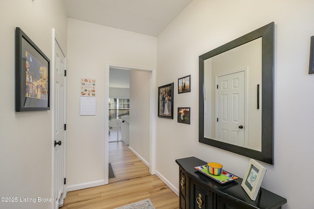 corridor with wood-type flooring