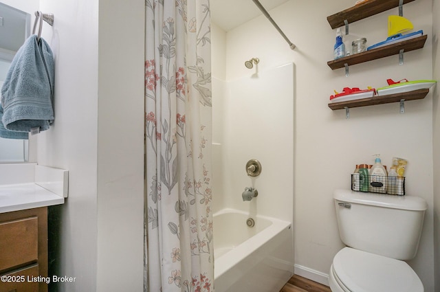 full bathroom featuring vanity, toilet, and shower / bath combo with shower curtain