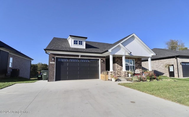 craftsman-style house with a garage and a front lawn