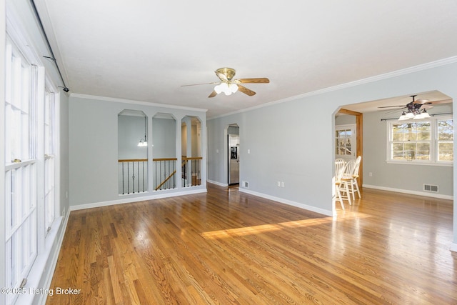 unfurnished room featuring crown molding, ceiling fan, and light hardwood / wood-style floors