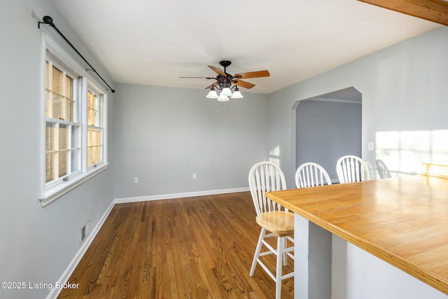 unfurnished dining area featuring hardwood / wood-style flooring and ceiling fan