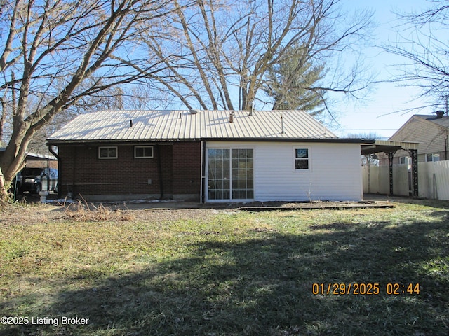 back of house with a yard and a pergola