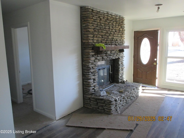 entrance foyer featuring hardwood / wood-style flooring and a fireplace