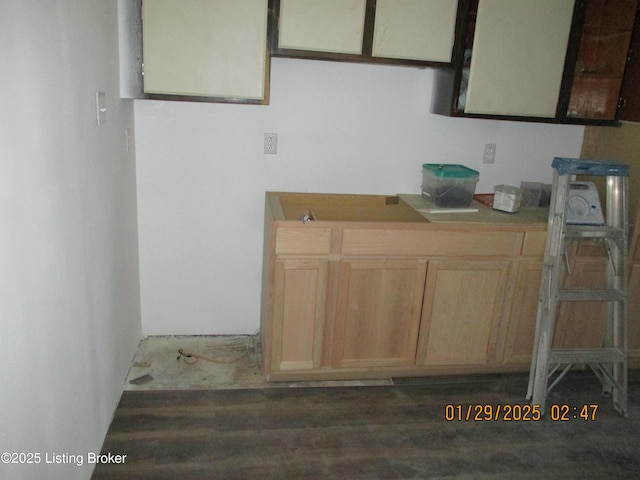 kitchen featuring dark wood-type flooring and light brown cabinets