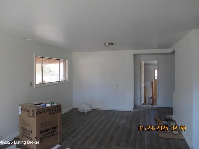 spare room with dark hardwood / wood-style floors