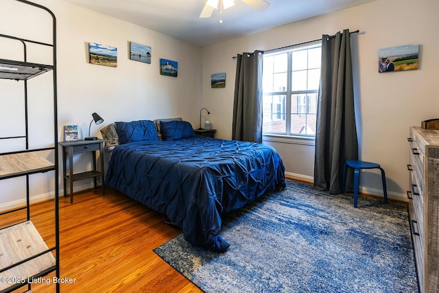 bedroom with hardwood / wood-style flooring and ceiling fan