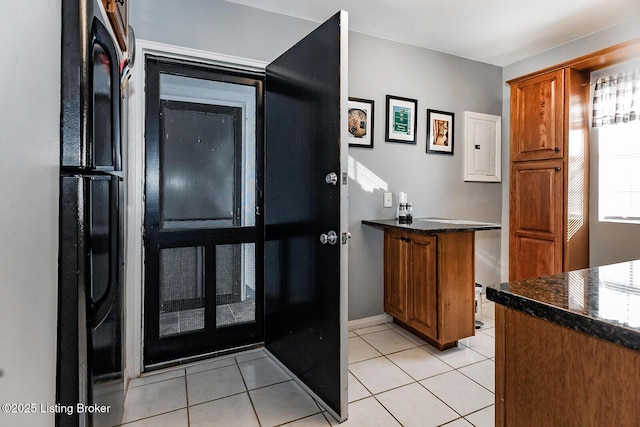 interior space with light tile patterned floors