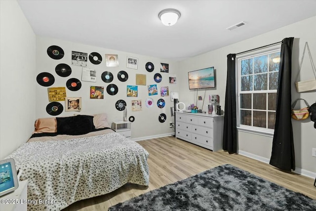 bedroom featuring light hardwood / wood-style flooring