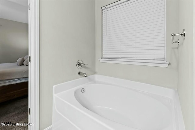 bathroom with a tub to relax in