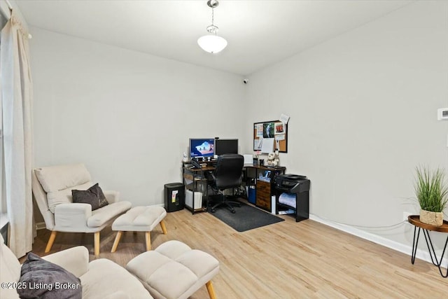 office space with light hardwood / wood-style floors