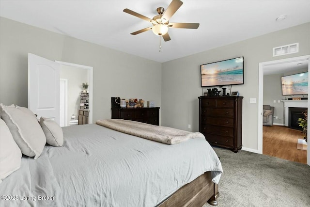 carpeted bedroom featuring ceiling fan