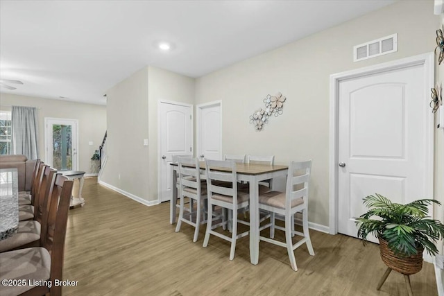 dining area with light hardwood / wood-style flooring