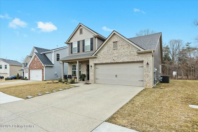 view of front of property with a garage, a porch, central AC, and a front yard