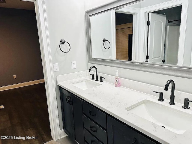 bathroom featuring vanity and wood-type flooring