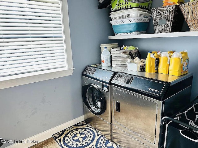 clothes washing area featuring washer and dryer