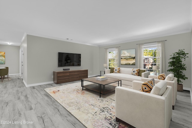 living room featuring ornamental molding and light wood-type flooring