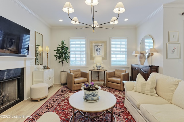 living room featuring a notable chandelier, hardwood / wood-style flooring, a high end fireplace, and ornamental molding