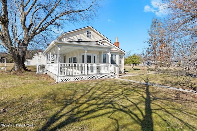 view of front of house featuring a porch and a front yard