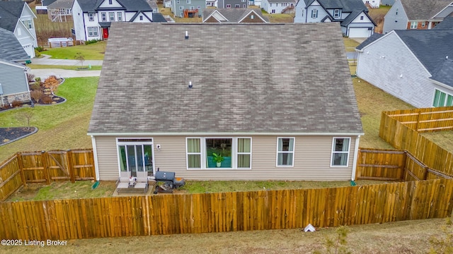 back of property with a patio